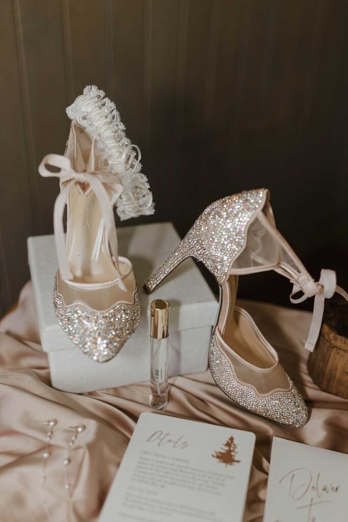 Wedding shoes sitting on top of decorative box on top of silk sheet at Valhalla in Lake Tahoe