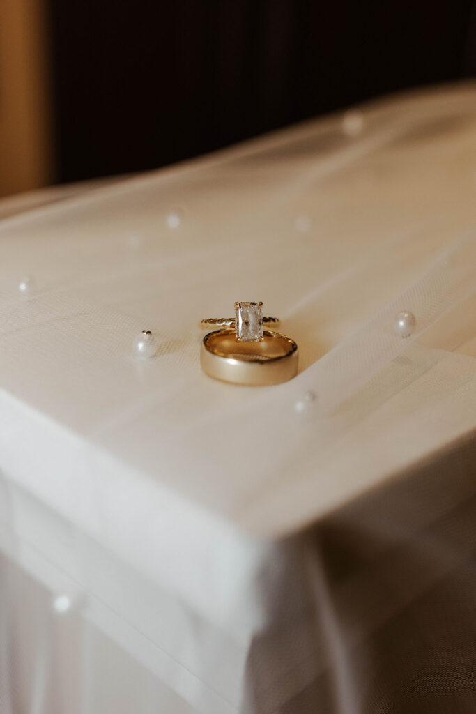 Wedding rings on wedding veil with small beads for elopement in Emerald Bay