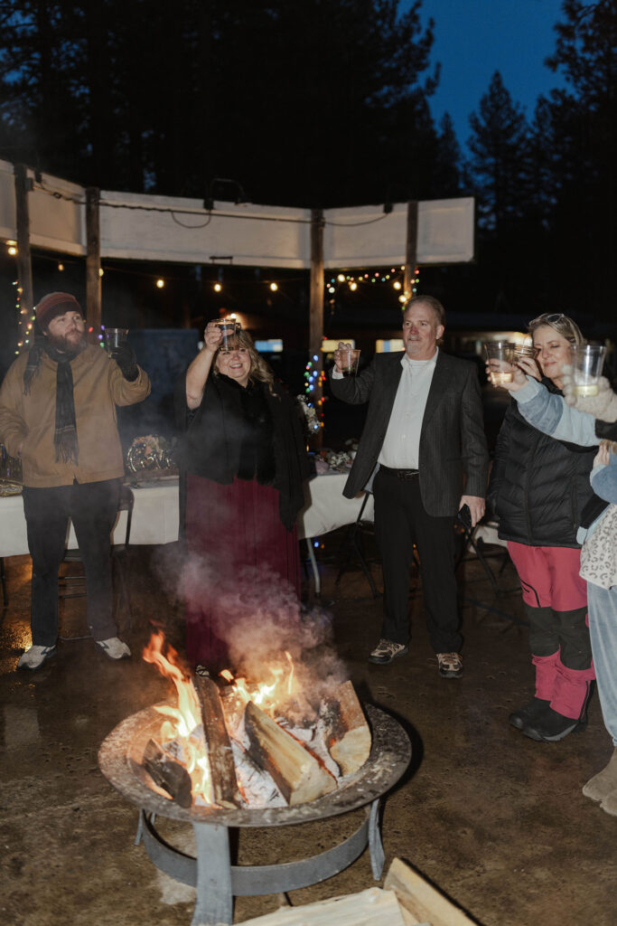 Guests holding up drinks during reception in Emerald Bay