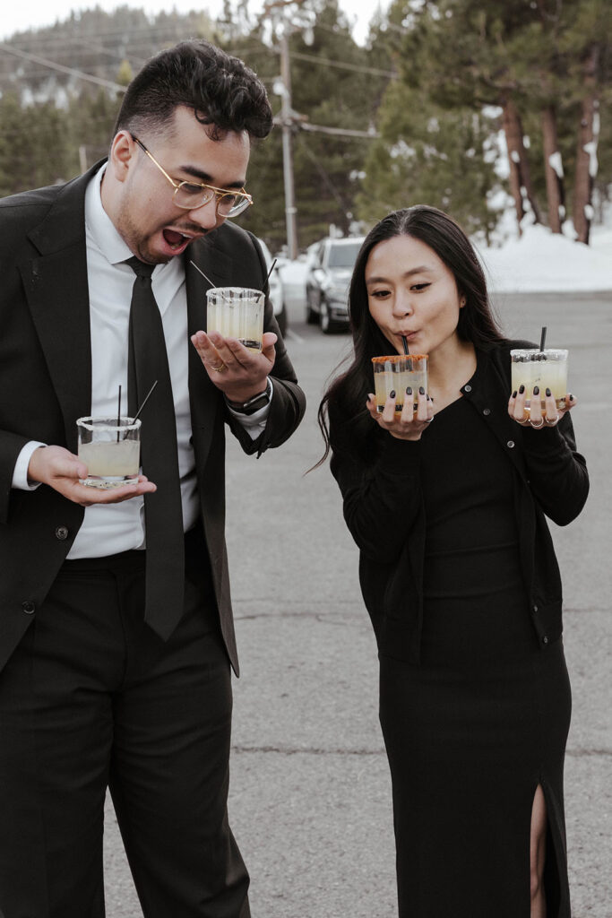 Guests holding drinks for wedding couple and sipping drinks of their own