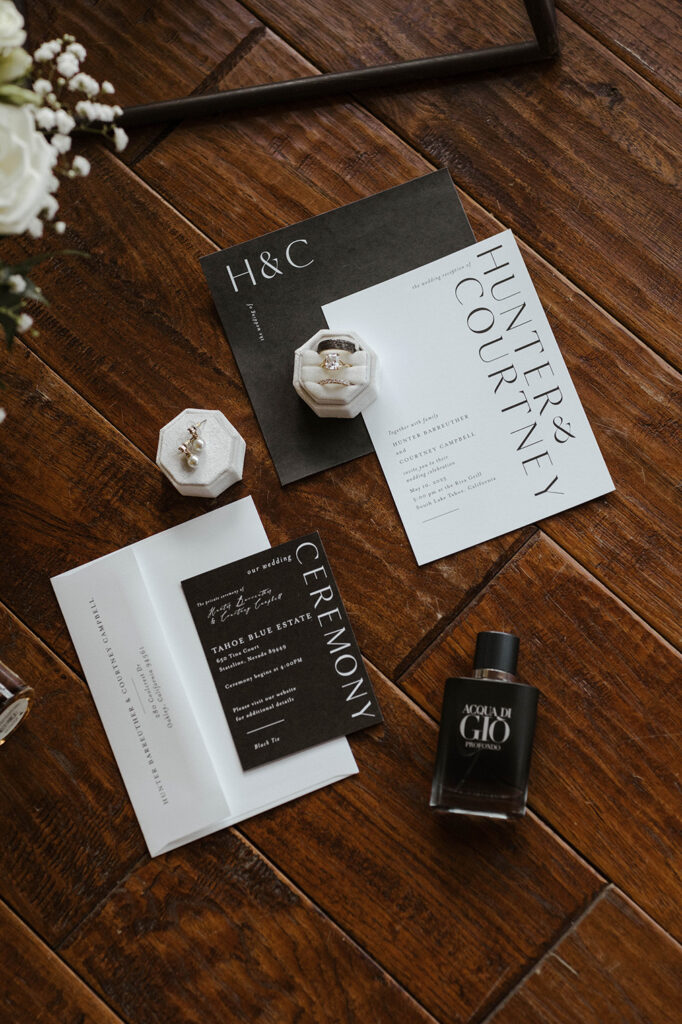 wedding invitations laid out with rings and details at tahoe blue estate
