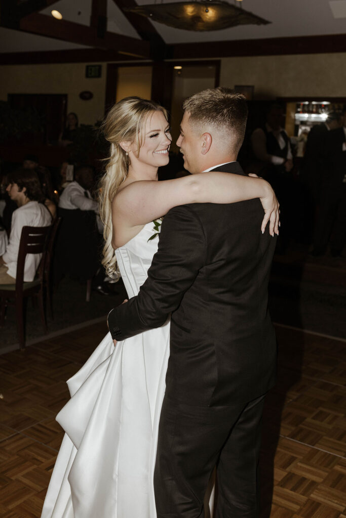 bride and groom sharing a first dance at riva grill 