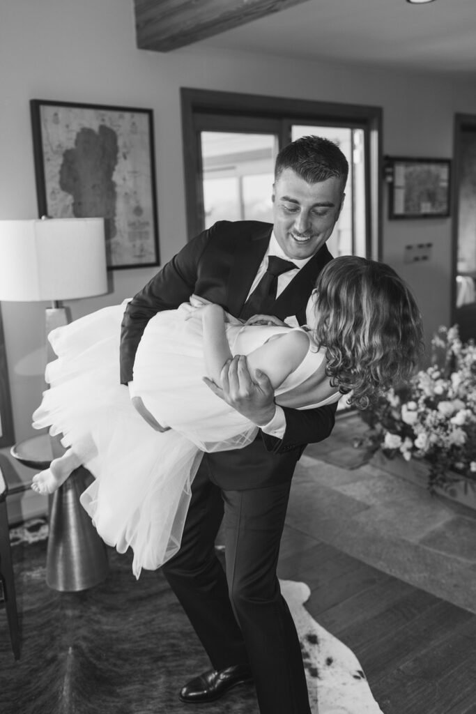 groom dancing with his daughter in a lace flower girl dress at tahoe blue estate