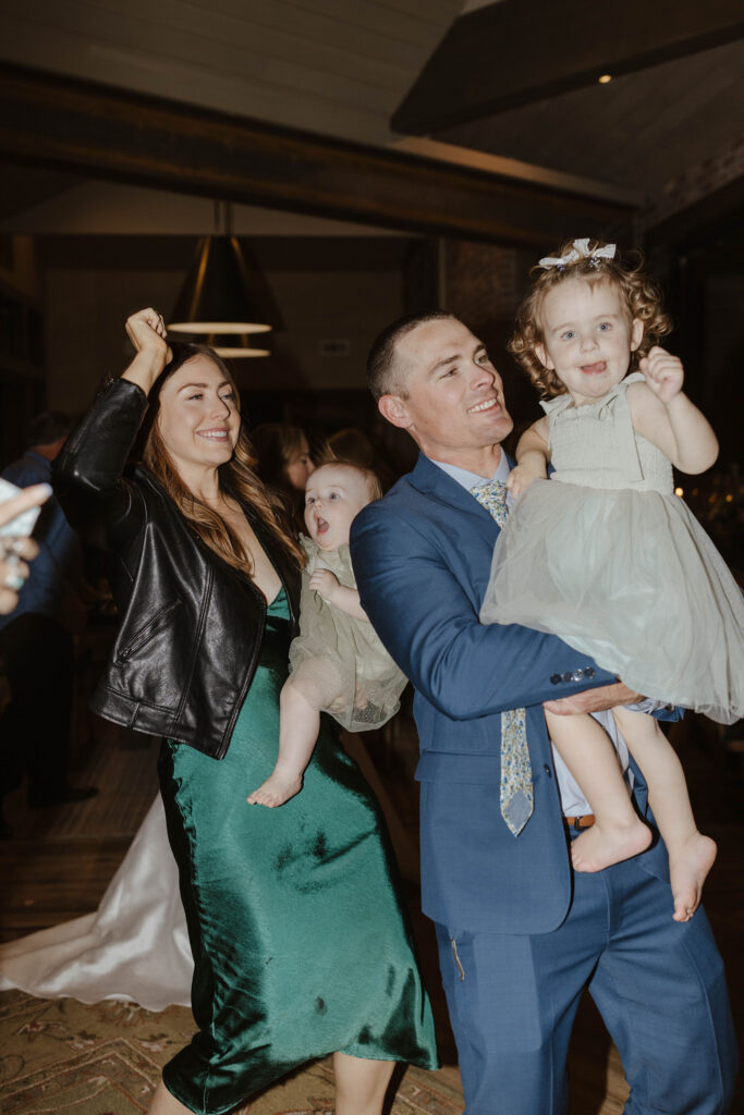 guests dancing with kids to celebrate newlyweds getting married in donner lake