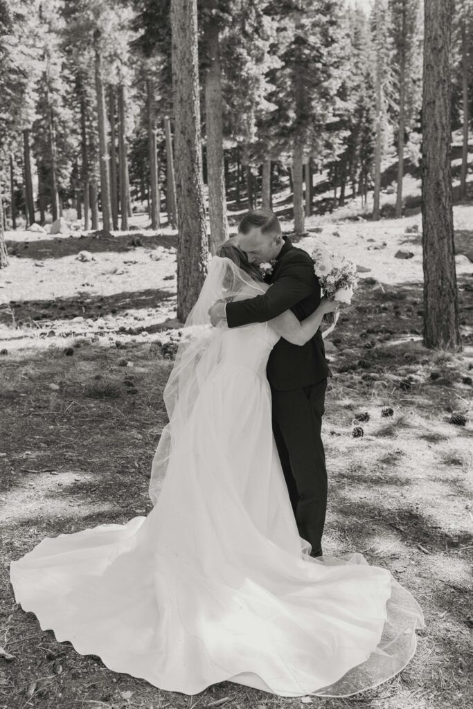 bride and groom hugging in donner lake