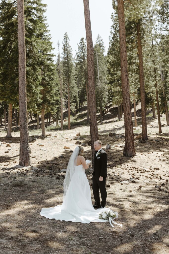 elopement couple sharing vows in the forest at donner lake 