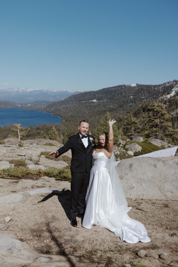 bride and groom smile and throw their hands up celebrating they just got married in donner lake