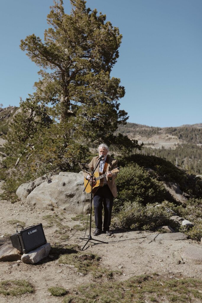 guitarist playing music for a summer elopement in donner lake