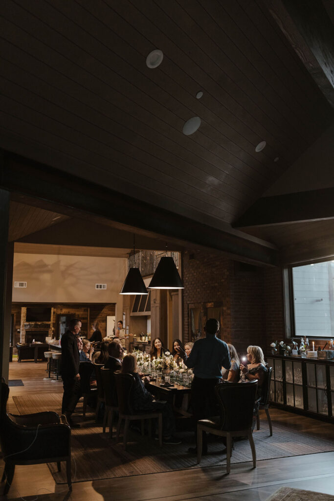guests gathered around the table for a candle-lit dinner in donner lake