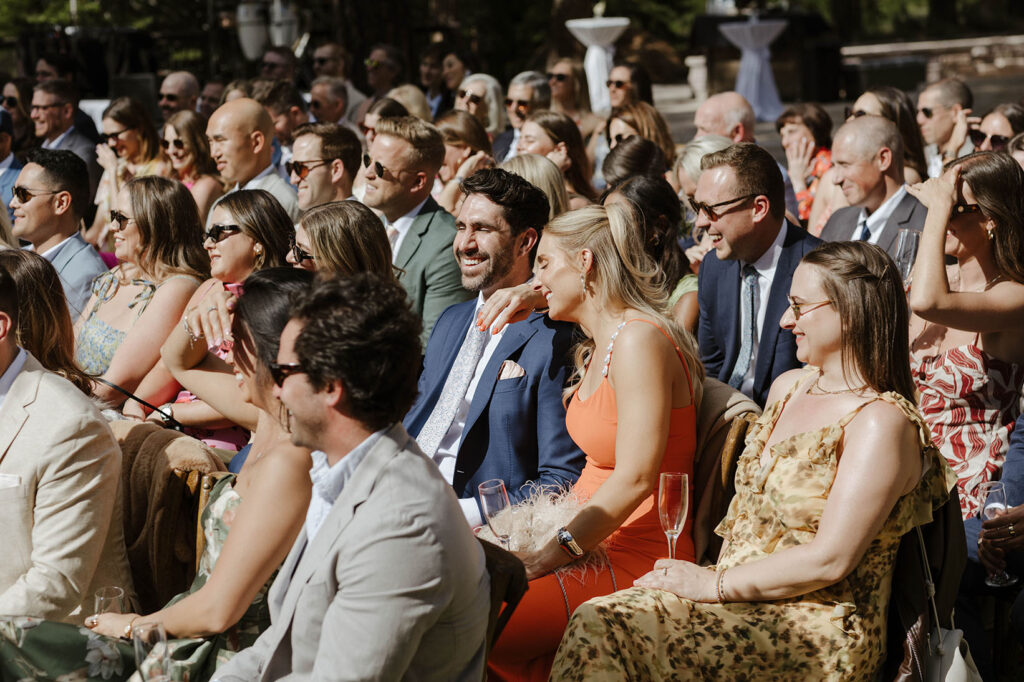 Guests laughing during wedding ceremony at Nakoma Resort
