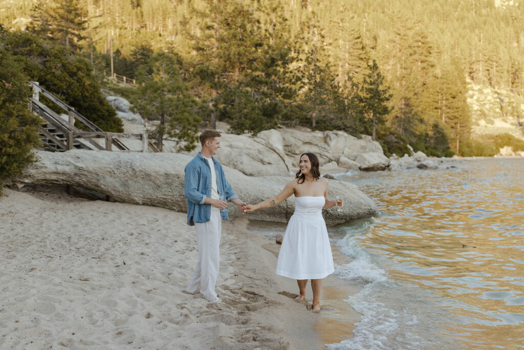 engagement couple dancing on the beach in north lake tahoe