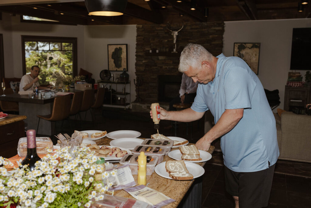 Wedding guest making sandwiches on large table inside at the Landing Tahoe Resort