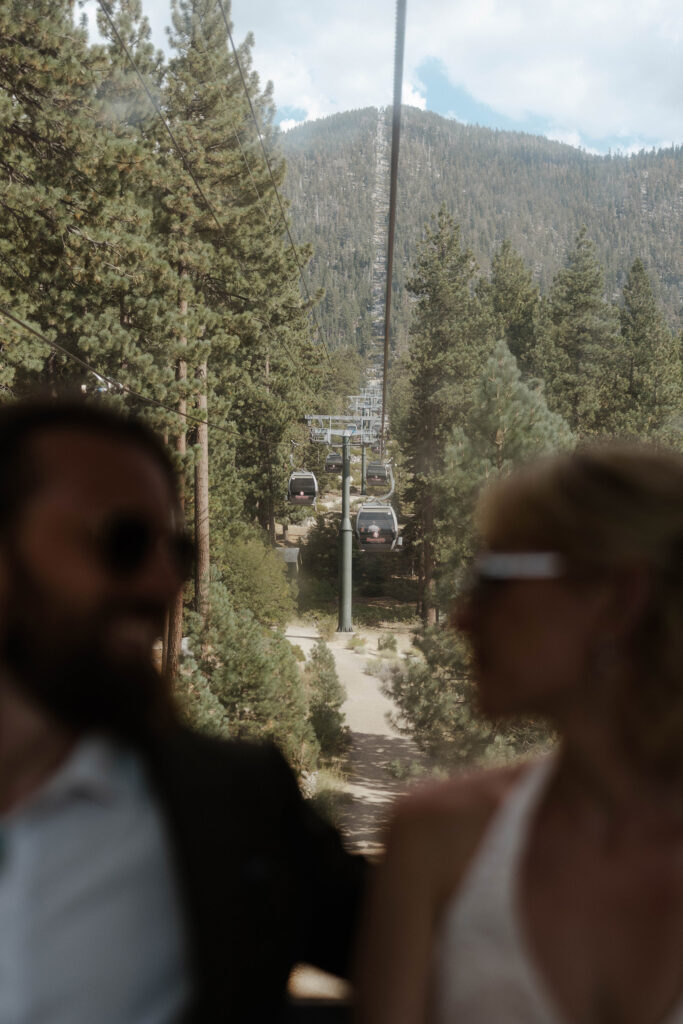 Heavenly gondolas riding up track while elopement couple smiles at each other in Lake Tahoe
