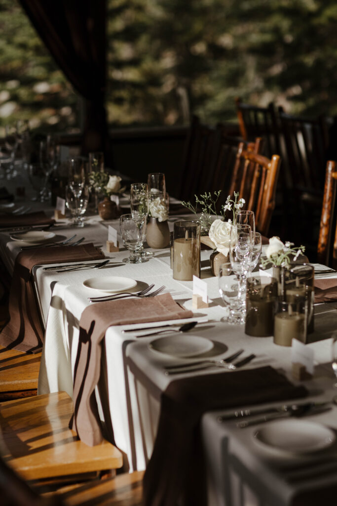 Close up of wedding reception table with neutral colored napkins and decor at Heavenly Lake View Lodge