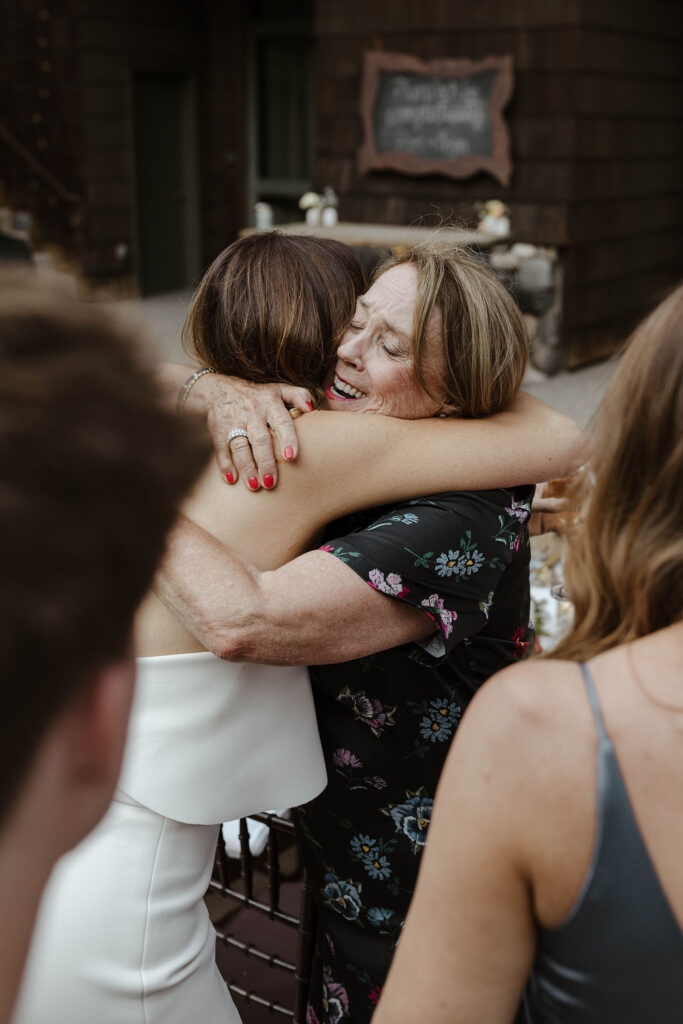 Bride hugging happy and emotional wedding guest at the PlumpJack Inn