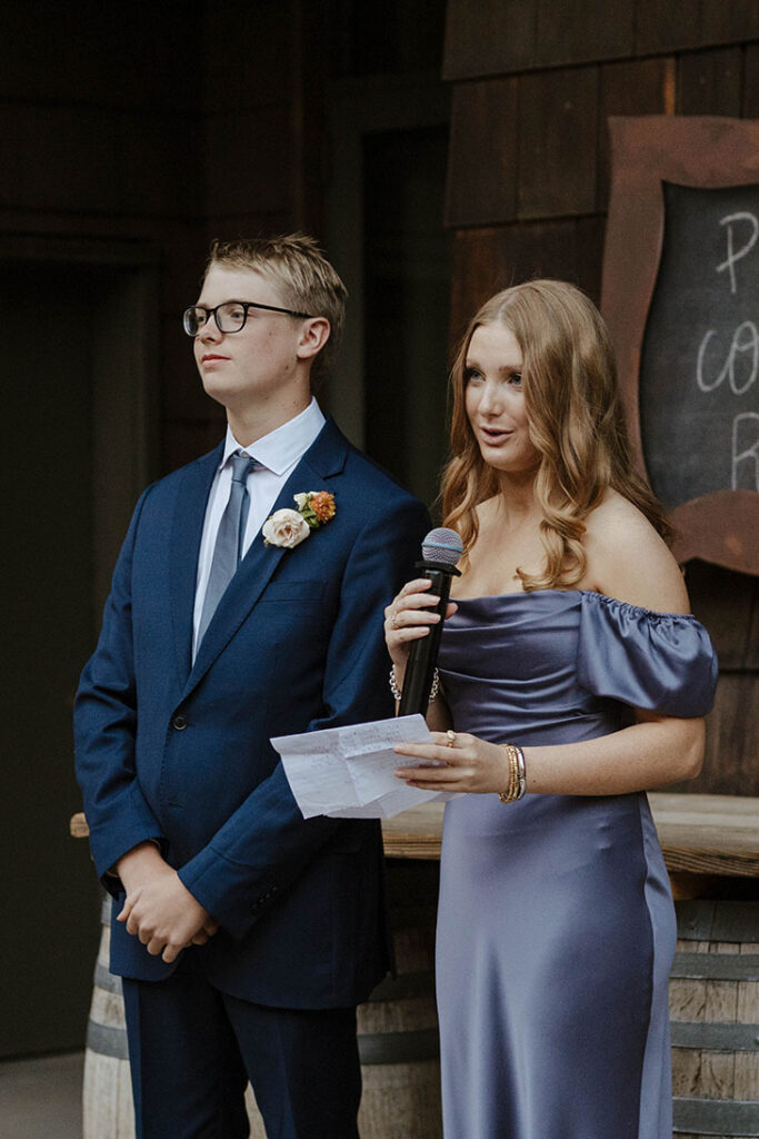 Kids of wedding couple standing and giving speeches during reception at the PlumpJack Inn