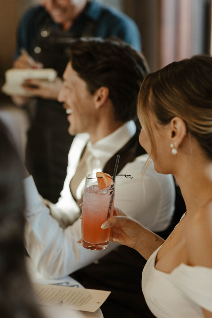 Close up of bride holding drink during wedding reception at Edgewood Tahoe