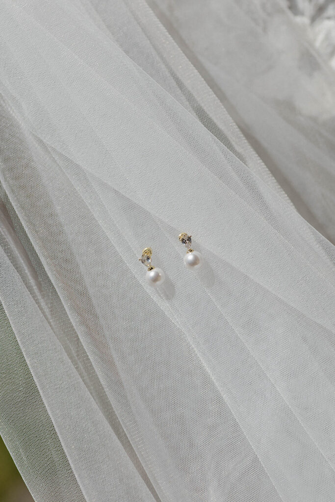 Bride's earrings on wedding veil at Garwoods Lake Tahoe