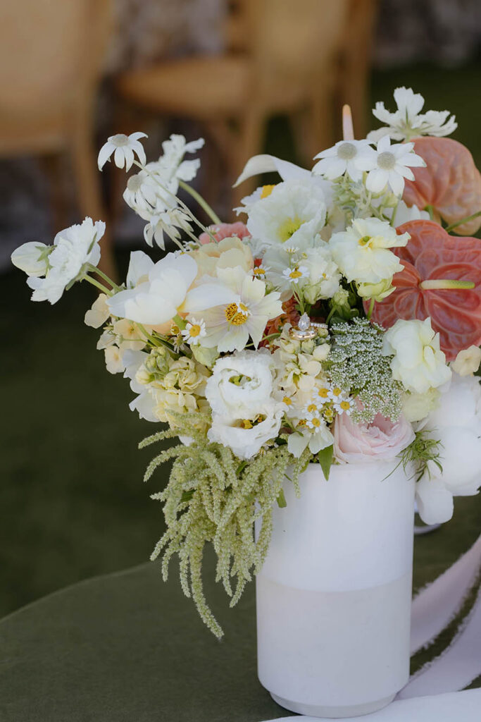 Colorful floral bouquet in white vase on green tablecloth at Everline Resort in Lake Tahoe