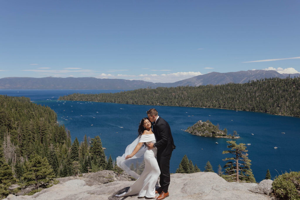 The groom kisses the bride’s forehead during their Emerald Bay Lake Tahoe elopement portraits