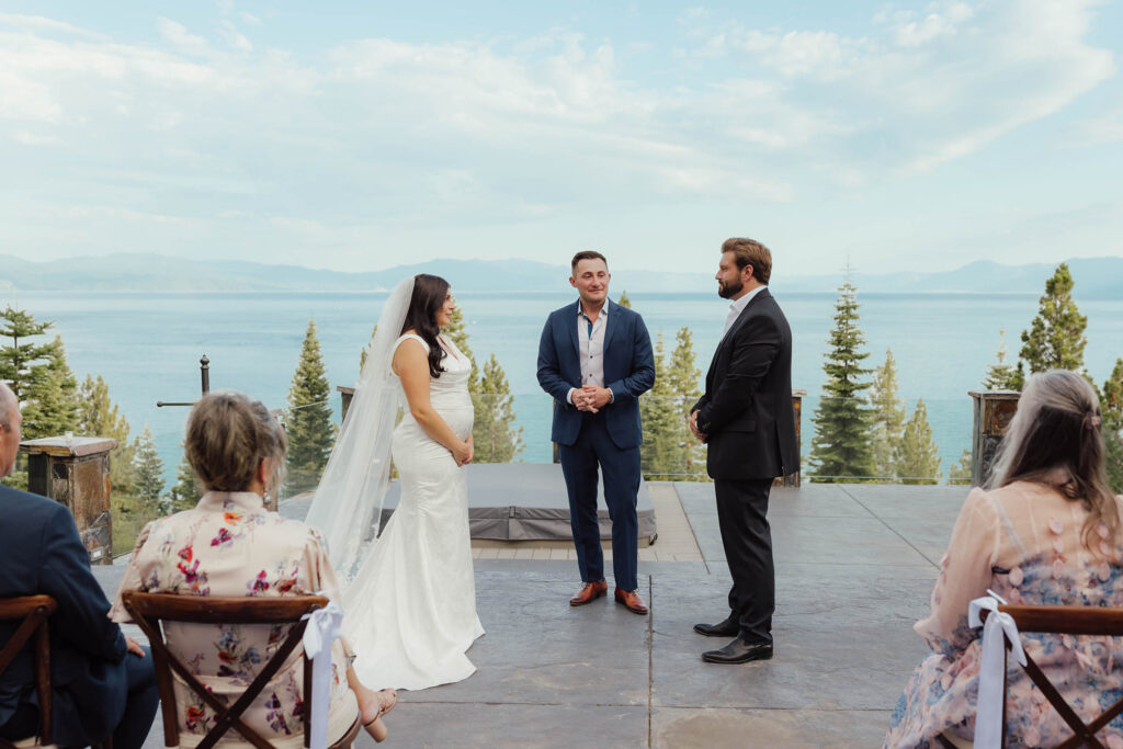 Bride and groom stand with their officiant during a Lake Tahoe wedding ceremony
