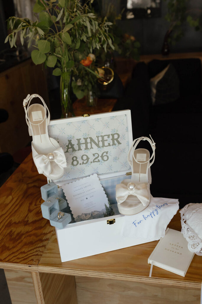Bridal shoes, wedding rings, invitation, and keepsakes for a summer wedding at Valhalla Tahoe