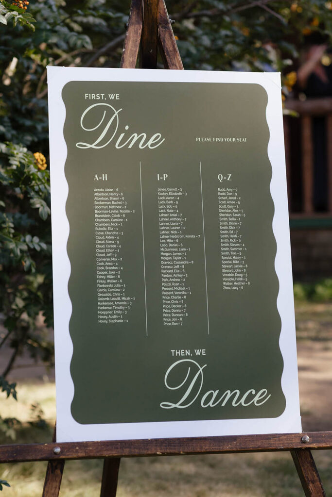 Green wedding seating chart reads “First, we dine, then, we dance” at Valhalla Tahoe