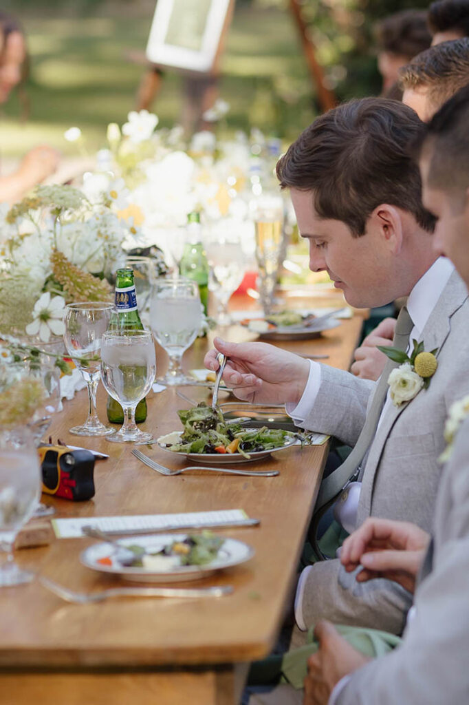 Wedding guest enjoys dinner at the outdoor Lake Tahoe reception