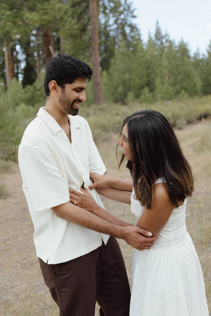 Engaged couple laughing and holding each other during their South Lake Tahoe engagement session