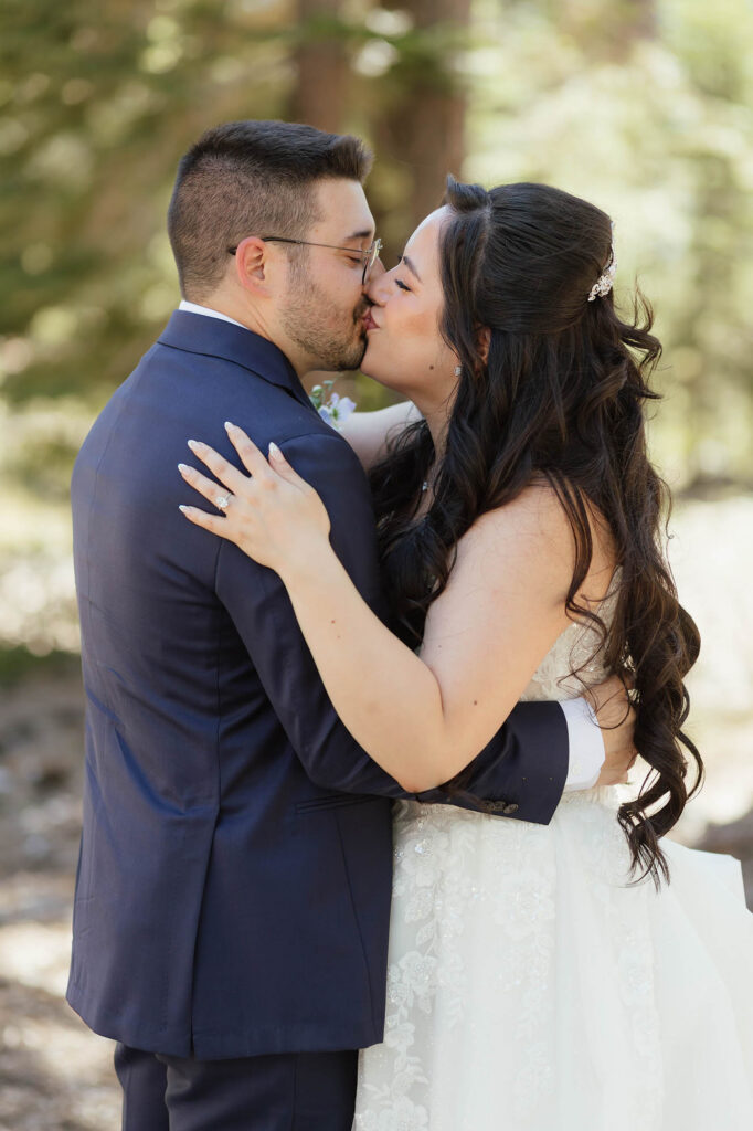 Bride and groom sharing a kiss during their summer Tahoe Blue Estate wedding