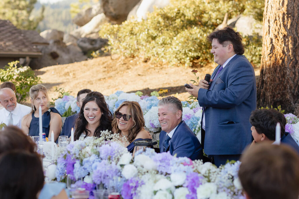Bride and family laughing during a reception speech at the Tahoe Blue Estate wedding