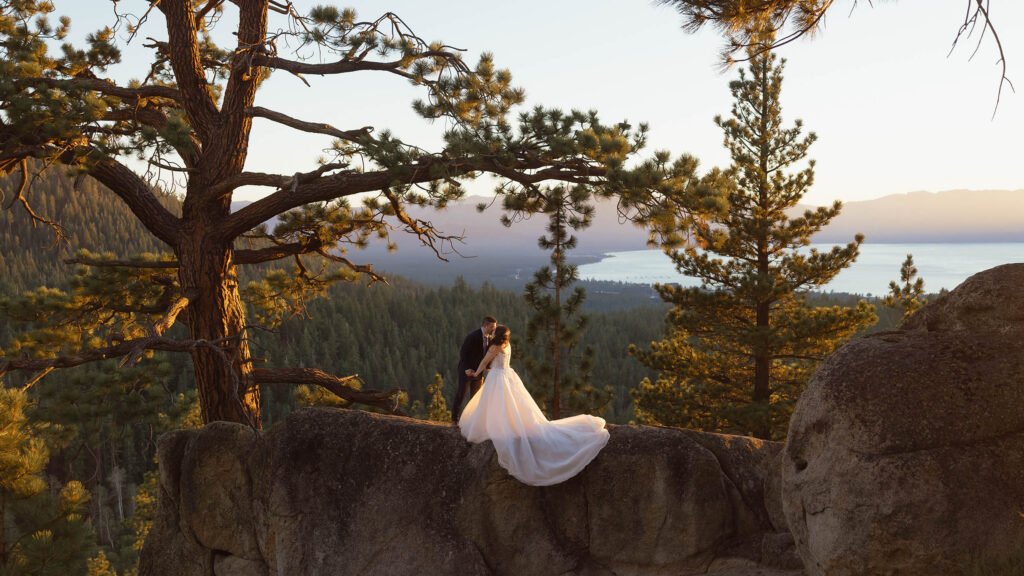 Bride and groom kidding on a granite rock at sunset at Tahoe Blue Estate